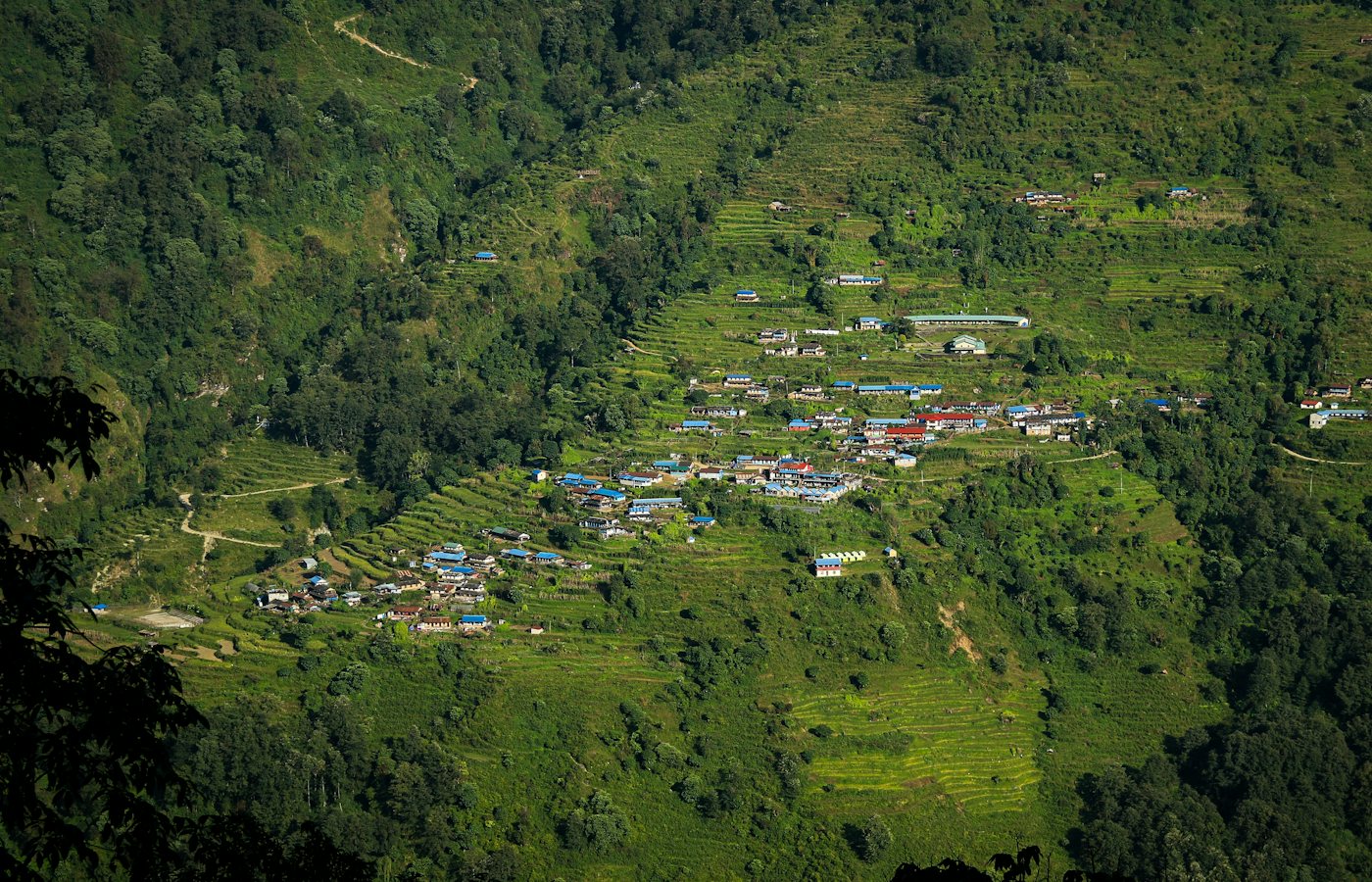 Green terraced hills and villages in the Nepal Himalaya
